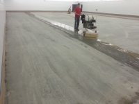 Initial cut or "grind" of concrete floor.